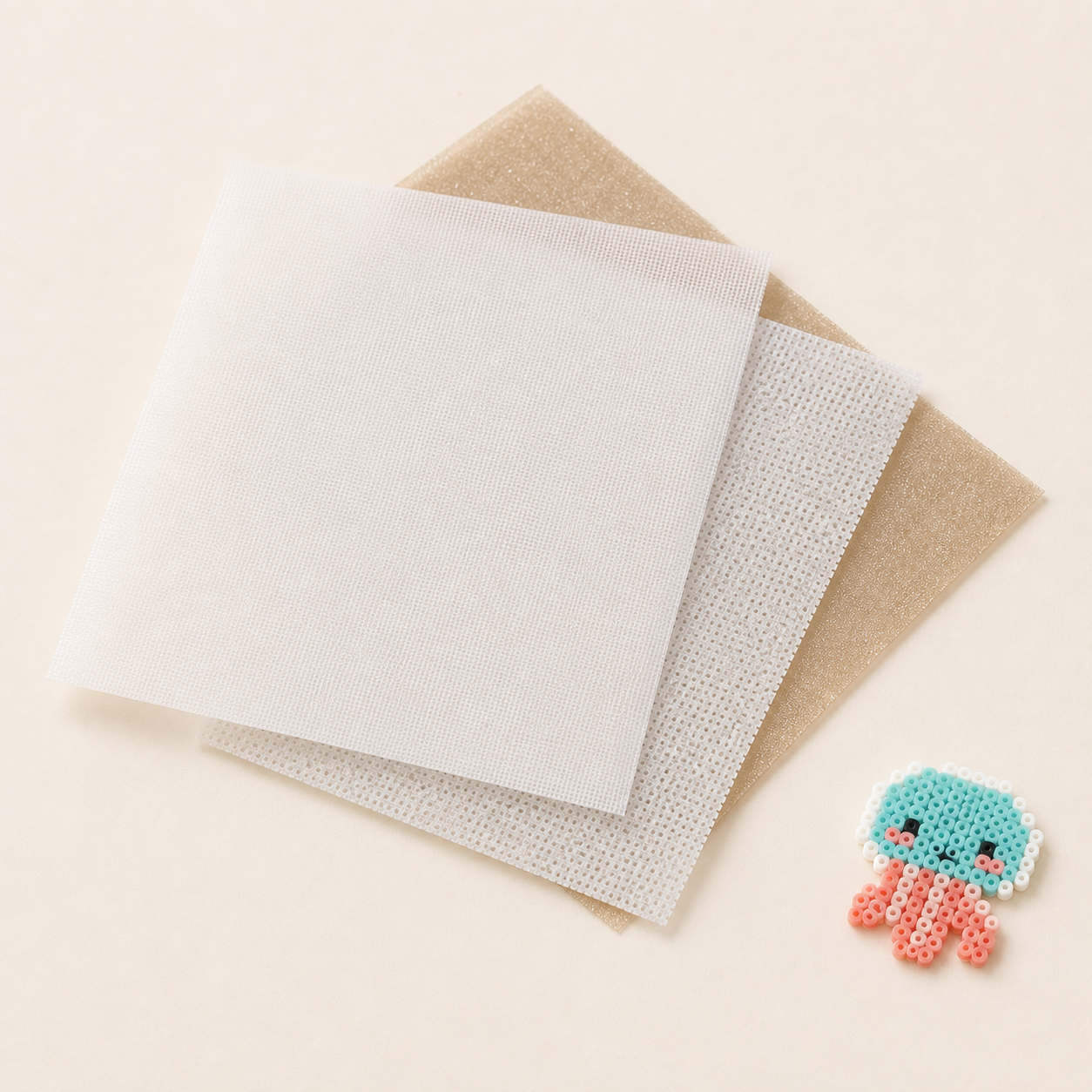Reusable ironing sheets in fine, coarse and tea shimmer finishes for fuse beads